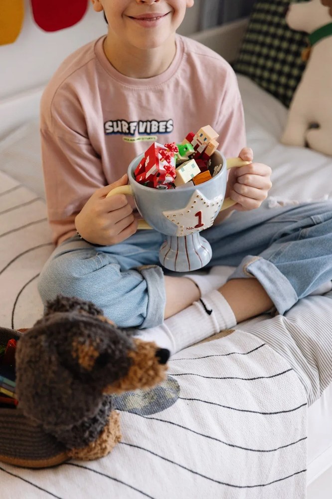 Ciemnobrązowy tekstylny dziecięcy kosz na zabawki 59x16x23 cm Sparky – Lorena Canals