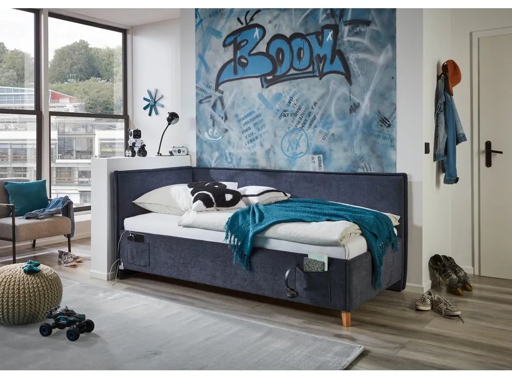 Ciemnoniebieskie tapicerowane narożne łóżko dziecięce ze schowkiem ze stelażem 140x200 cm Fun – Meise Möbel