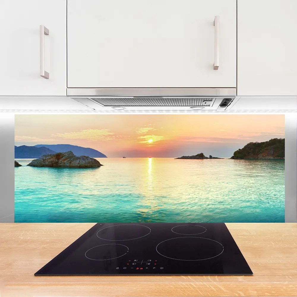 Panel Szklany Słoneczny Blask na Skalistym Brzegu