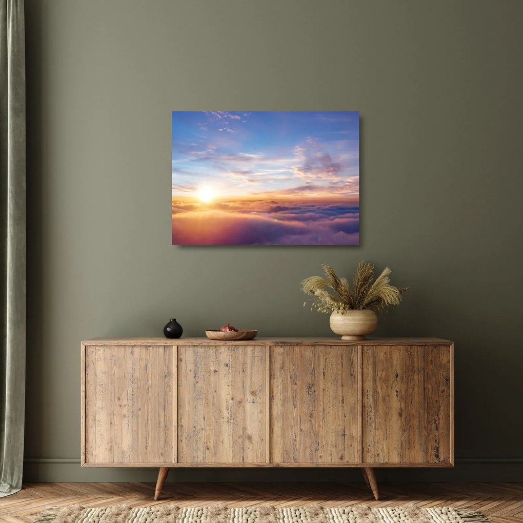 Obraz na szkle - Zachód słońca ponad chmurami (70x50 cm)
