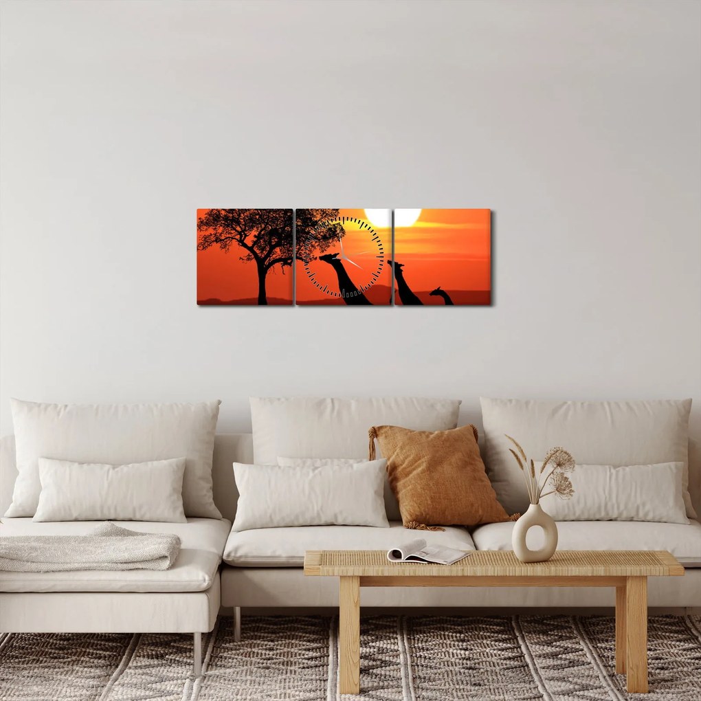 Obraz żyraf o zachodzie słońca (z zegarem) (90x30 cm)