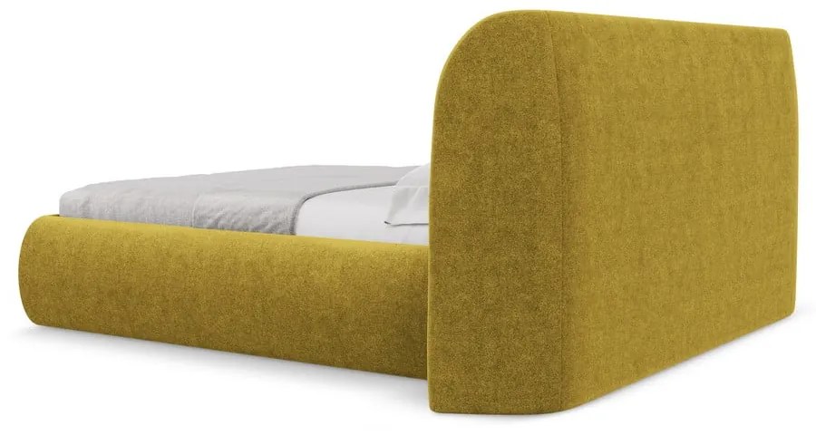 Musztardowe tapicerowane łóżko dwuosobowe ze schowkiem i stelażem 160x200 cm Hauke – Makamii