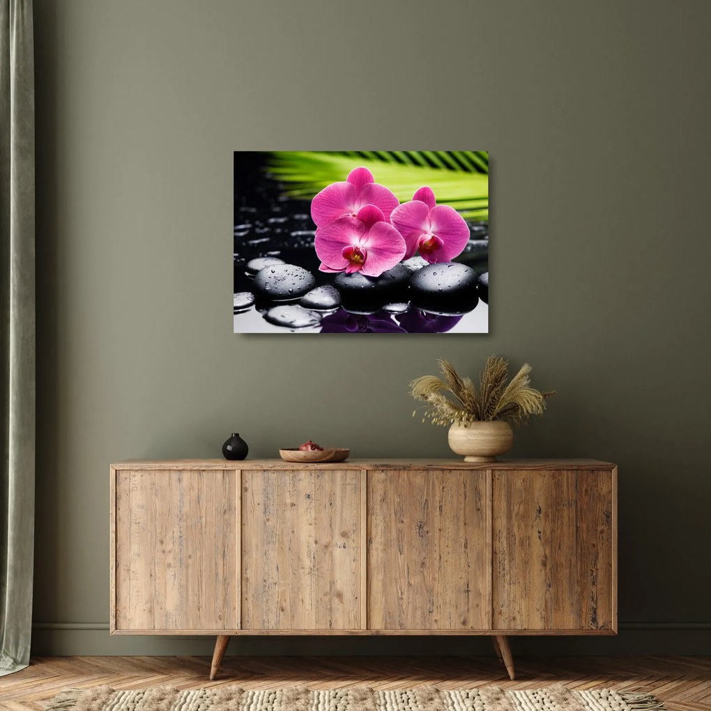 Obraz na szkle - Różowe orchidee z liściem palmy (70x50 cm)
