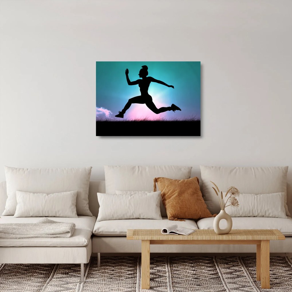 Obraz na szkle skaczącej sylwetki kobiety (70x50 cm)