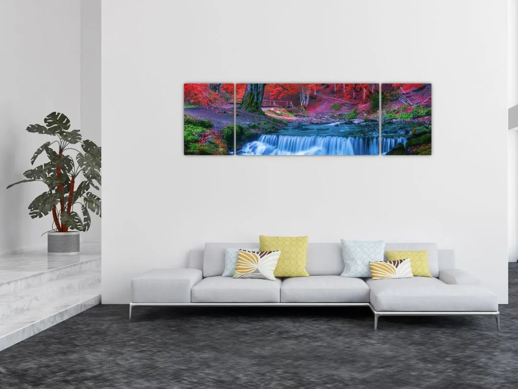 Obraz wodospadu w czerwonym lesie (170x50 cm)