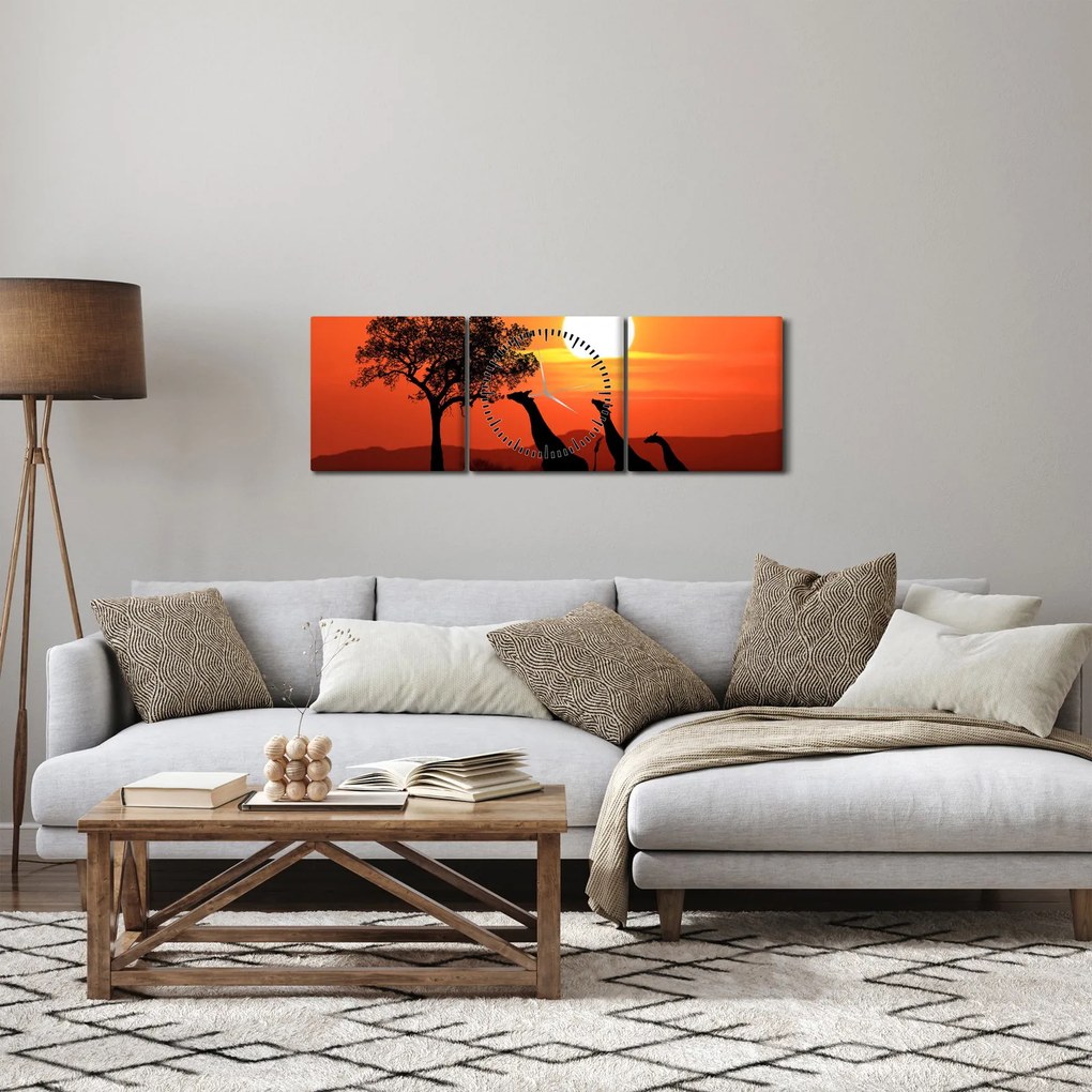 Obraz żyraf o zachodzie słońca (z zegarem) (90x30 cm)