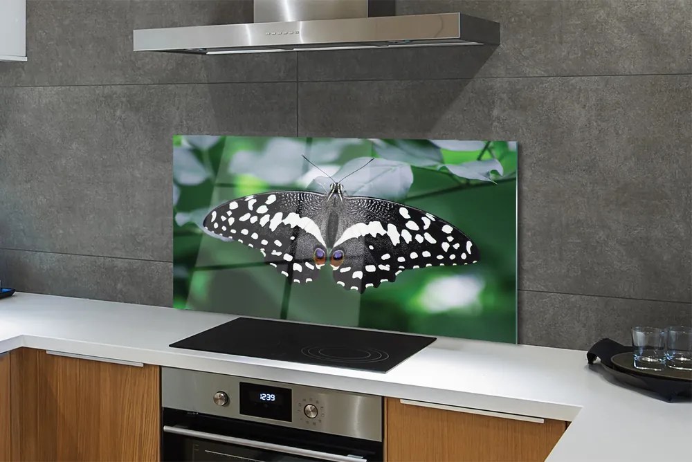 Panel Szklany Motyl na Zielonych Liściach