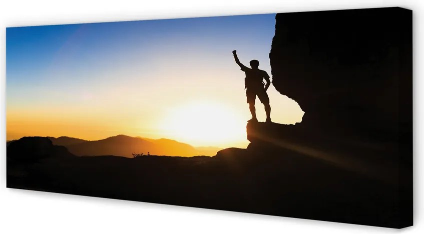 Obraz drukowany na płótnie Człowiek w Górach o Zachodzie