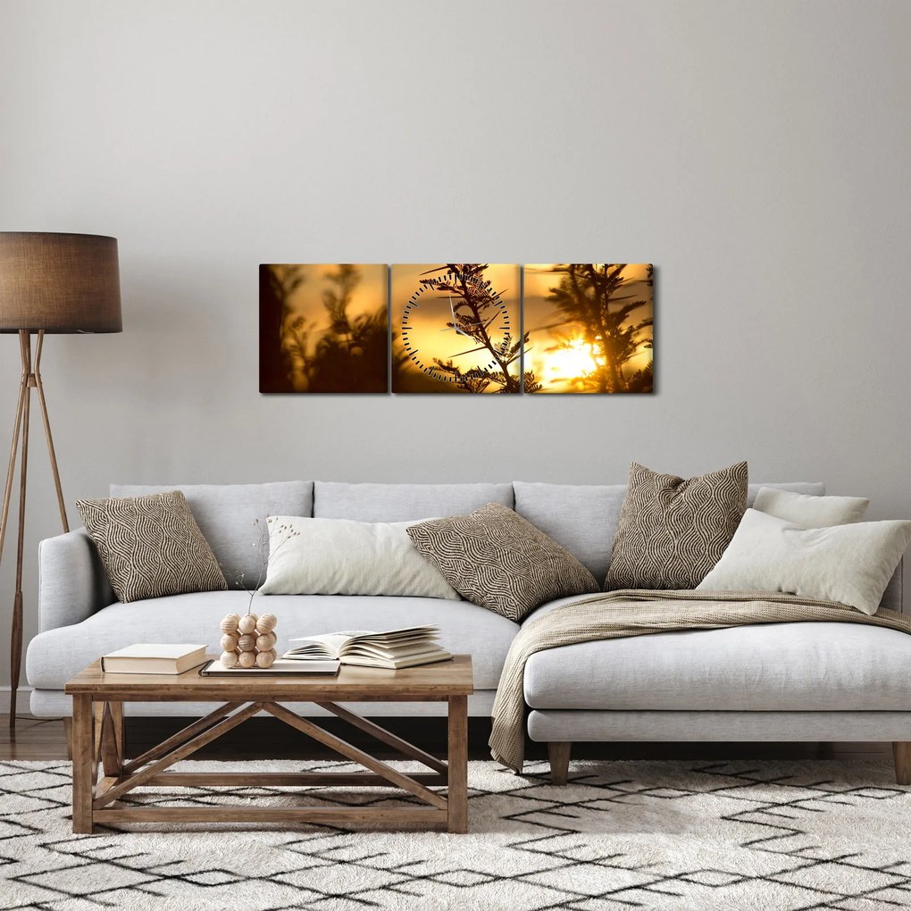 Obraz - słońce zachodzące za drzewami (z zegarem) (90x30 cm)
