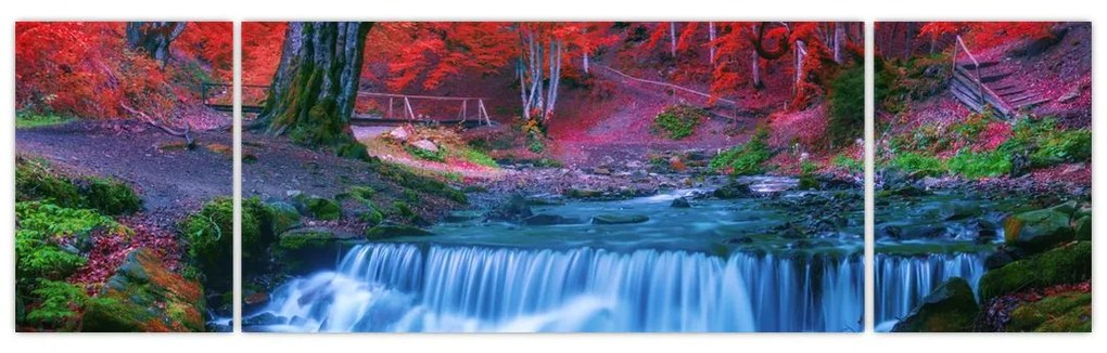 Obraz wodospadu w czerwonym lesie (170x50 cm)