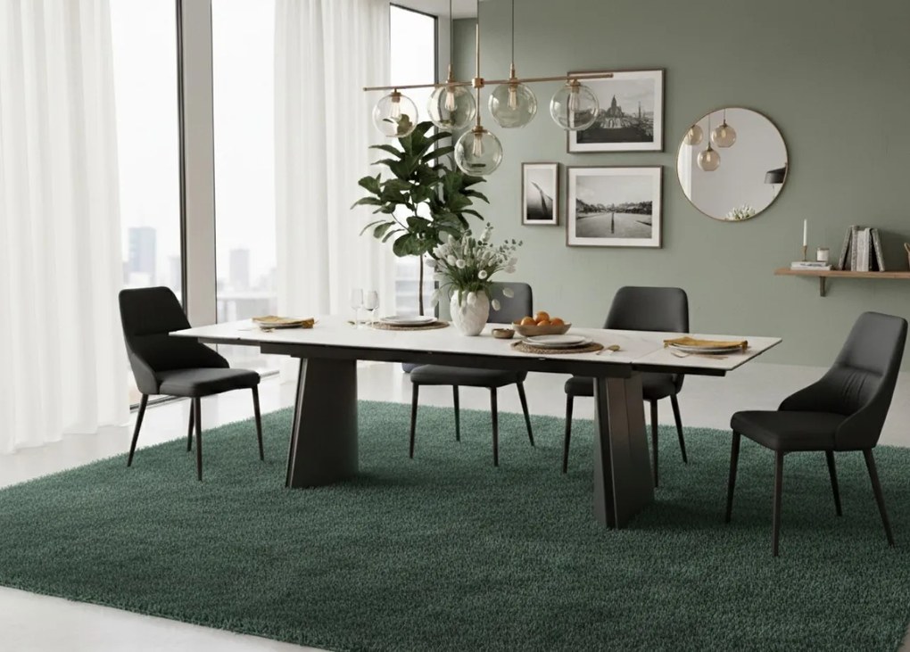 Nowoczesny stół rozkładany Nexus o wymiarach 200(280)×90 cm zachwyca eleganckim blatem z masy ceramicznej i solidną podstawą ze stali szczotkowanej. Styl, trwałość i funkcjonalność w jednym – idealny do jadalni i salonu.