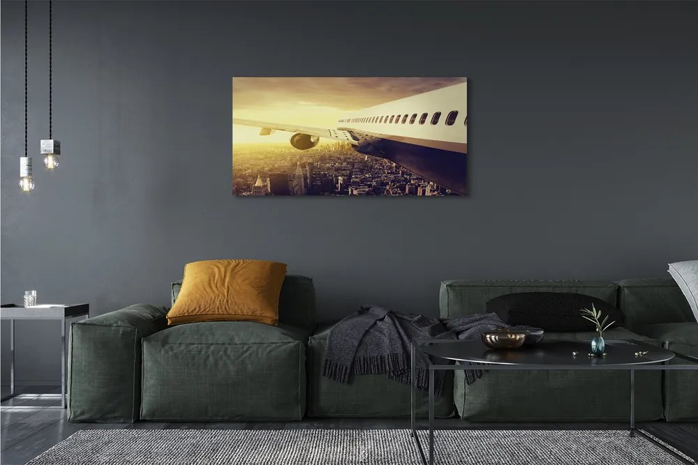 Obraz na płótnie Samolot nad Wieczornym Miastem
