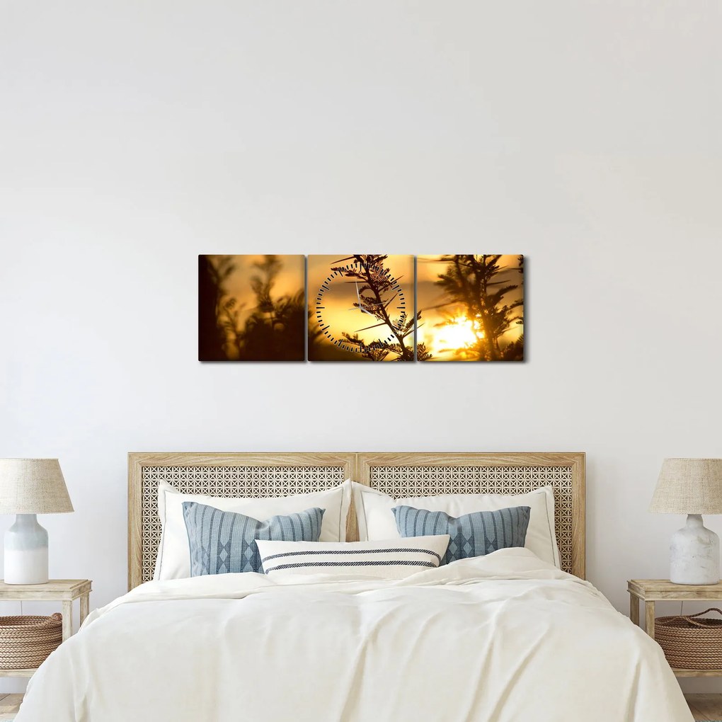 Obraz - słońce zachodzące za drzewami (z zegarem) (90x30 cm)