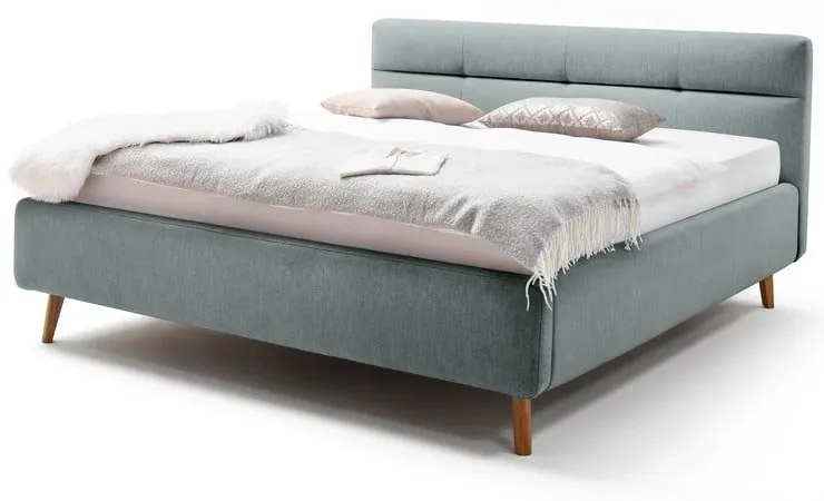 Jasnoniebieske tapicerowane łóżko dwuosobowe ze schowkiem i stelażem 180x200 cm Lotte – Meise Möbel