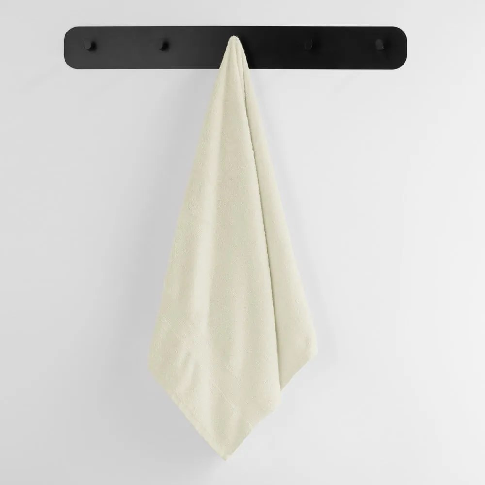 Kremowy bawełniany ręcznik frotte 30x50 cm Marina – DecoKing
