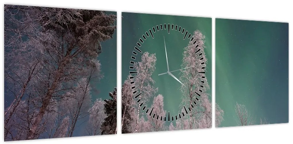 Obraz zorzy polarnej nad zamarzniętymi drzewami (z zegarem) (90x30 cm)