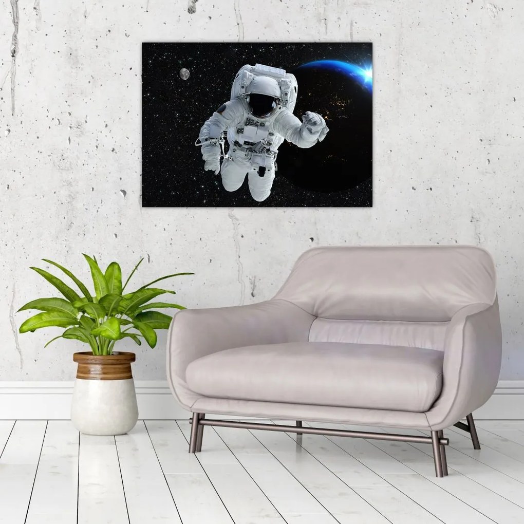 Obraz na szkle - Astronauta w kosmosie (70x50 cm)