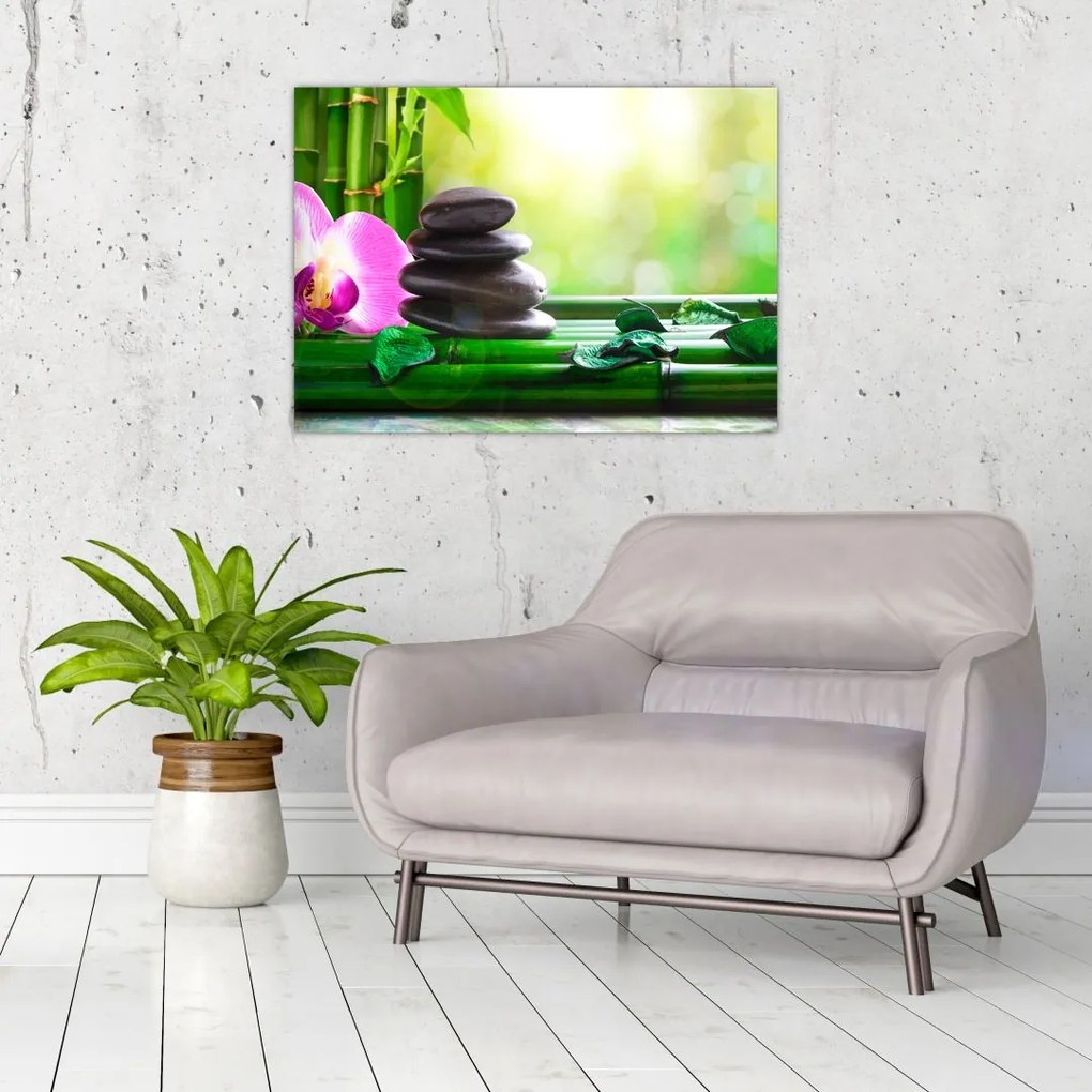 Obraz na szkle - kamienie do masażu i storczyki na wodzie (70x50 cm)