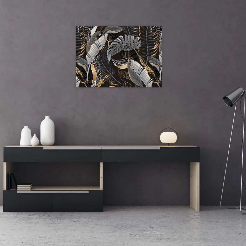 Obraz - Tropikalne liście w kolorze czarno - złotym (70x50 cm)