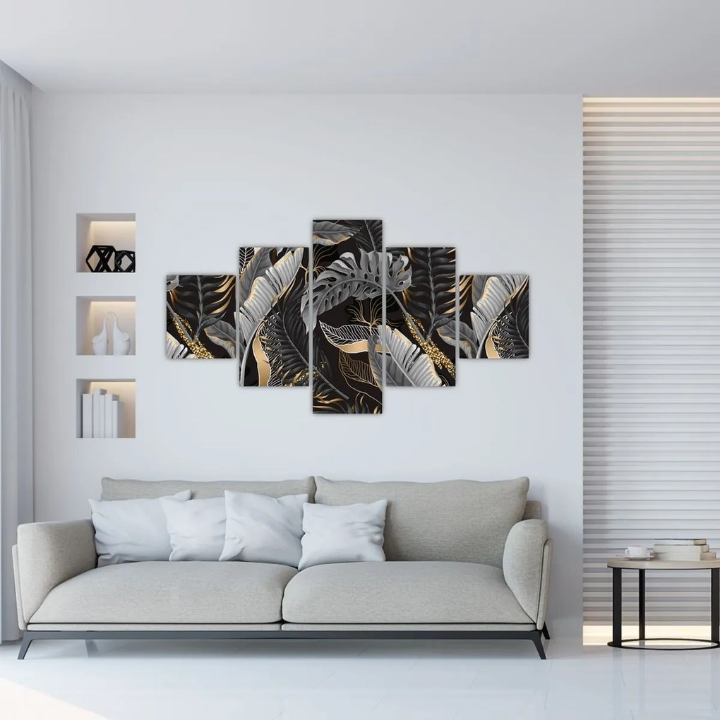Obraz - Tropikalne liście w kolorze czarno - złotym (125x70 cm)