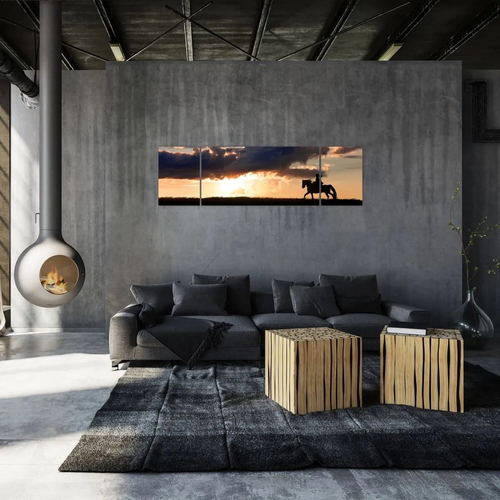 Obraz - Jeździec na koniu o zachodzie słońca (170x50 cm)