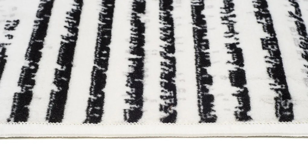 Prostokątny kremowy dywan w nowoczesny wzór C3-D74