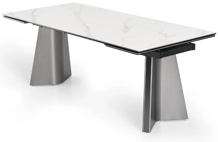 Nowoczesny stół rozkładany Nexus o wymiarach 200(280)×90 cm zachwyca eleganckim blatem z masy ceramicznej i solidną podstawą ze stali szczotkowanej. Styl, trwałość i funkcjonalność w jednym – idealny do jadalni i salonu.