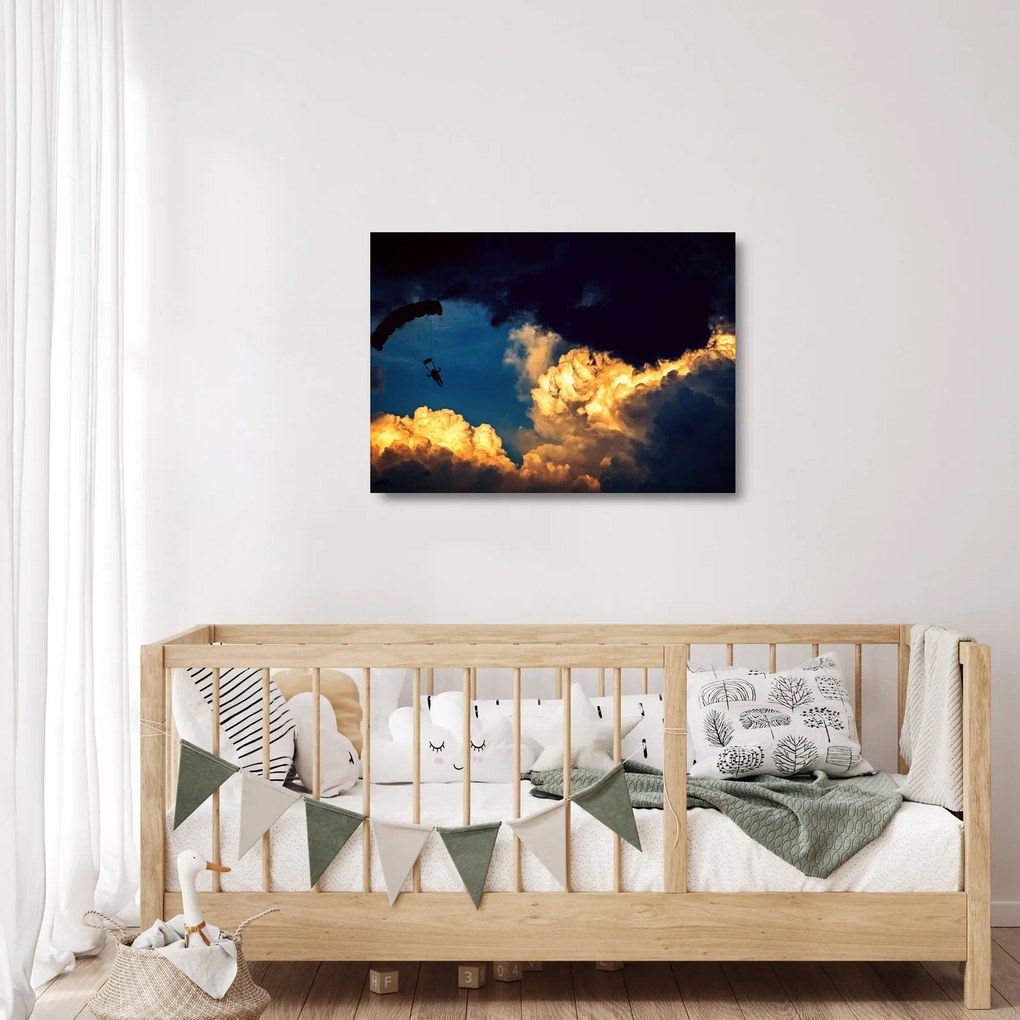 Obraz na szkle skoczka spadochronowego w chmurach (70x50 cm)