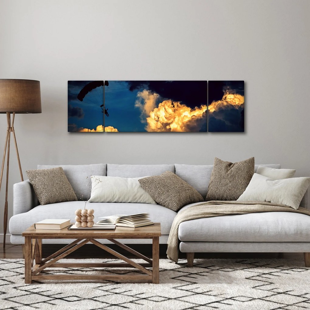 Obraz skoczka spadochronowego w chmurach (170x50 cm)