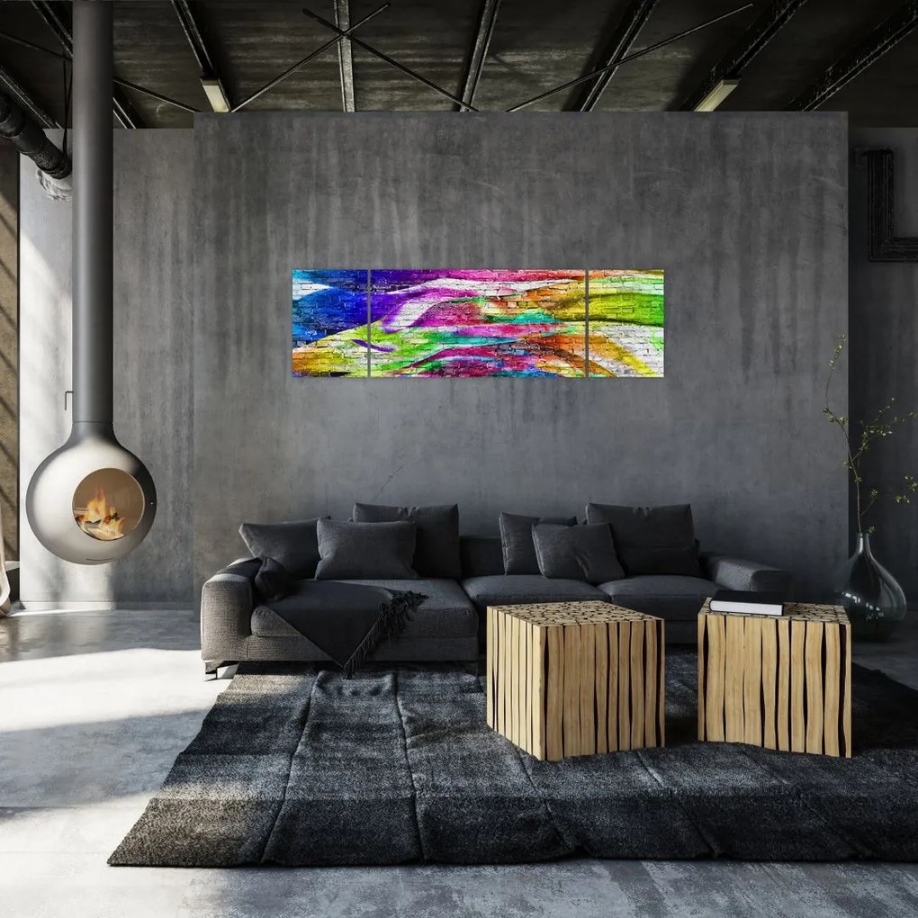Obraz - Mur z cegły z kolorowymi płomieniami (170x50 cm)
