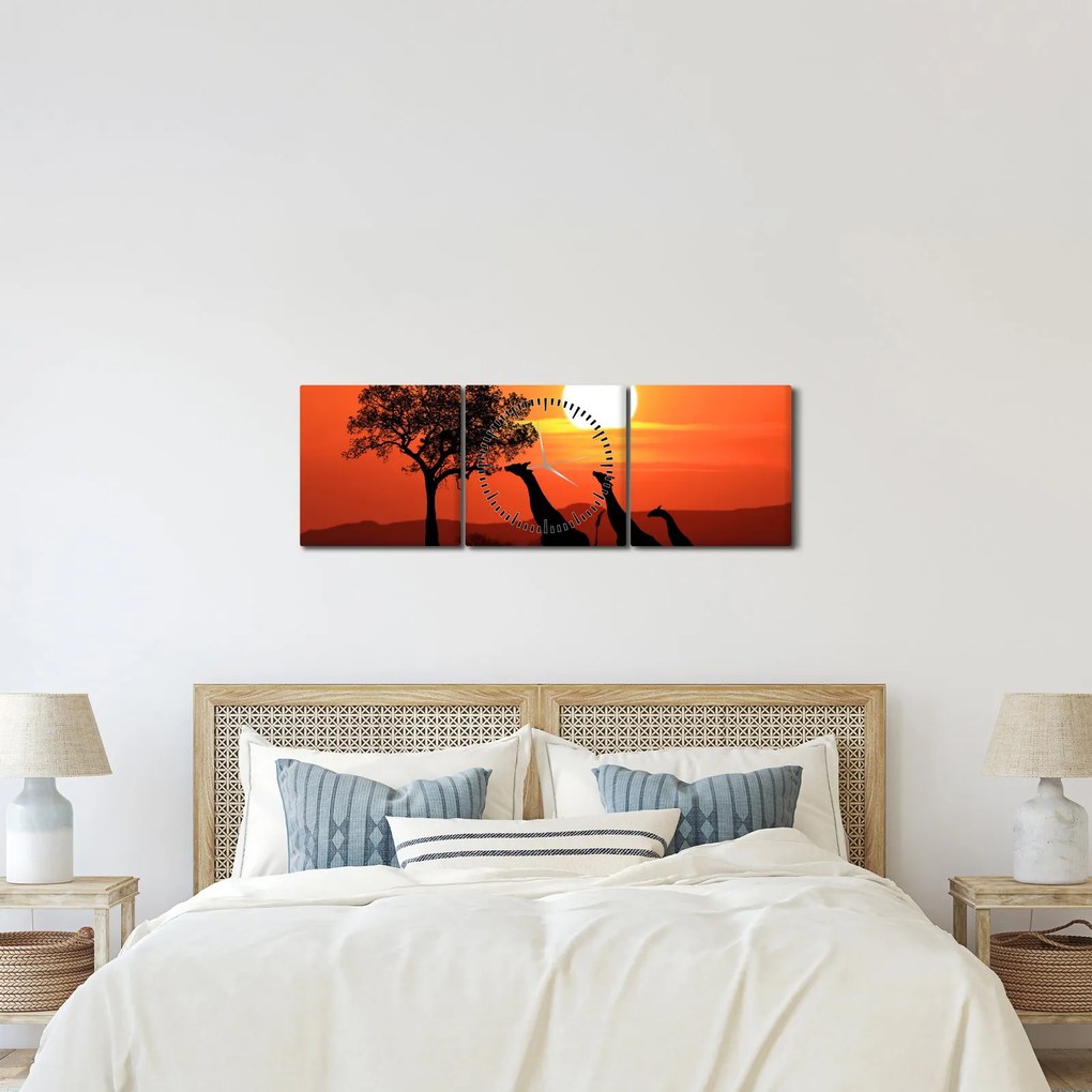 Obraz żyraf o zachodzie słońca (z zegarem) (90x30 cm)
