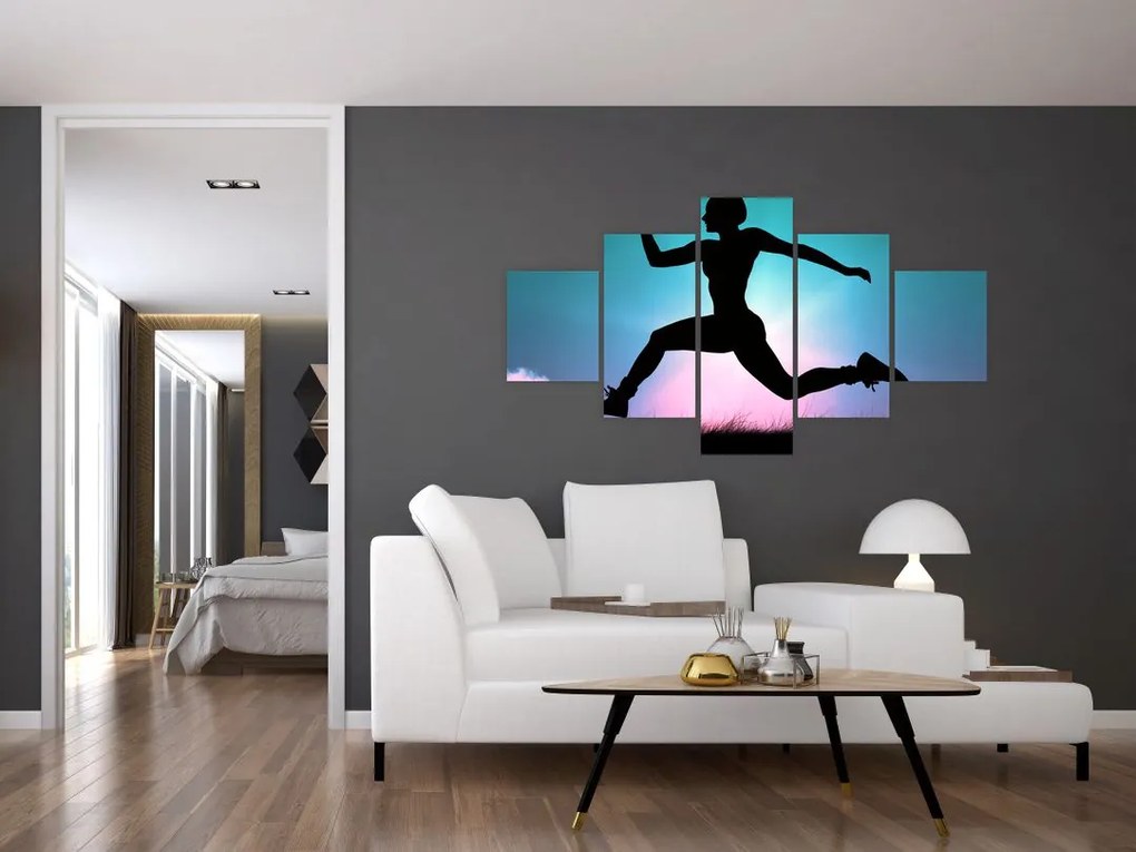 Obraz skaczącej sylwetki kobiety (125x70 cm)