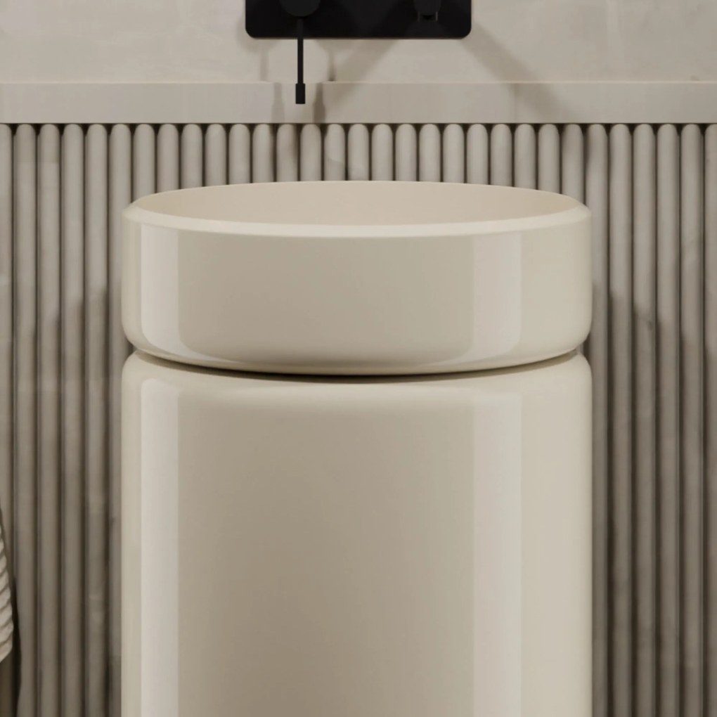 Umywalka z konglomeratu wolnostojąca okrągła beżowa błyszcząca 85 x 40 cm RONA Beige Glow : Podłączenie syfonu - Do ściany