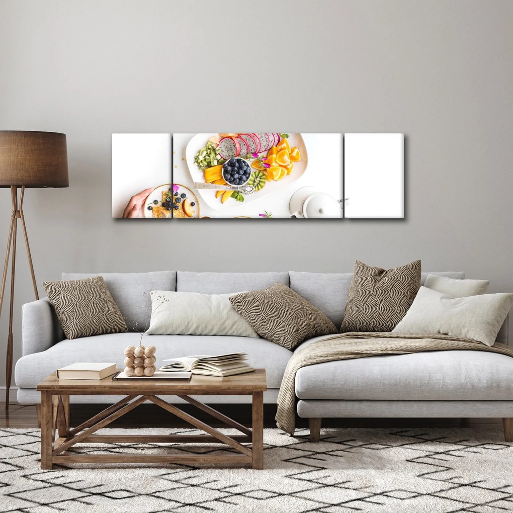 Obraz talerzy z owocami na stole (170x50 cm)