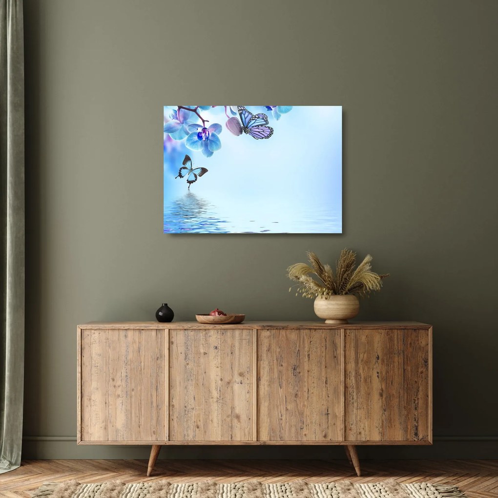 Obraz na szkle - Motyl na kwiatach orchidei, niebieski (70x50 cm)