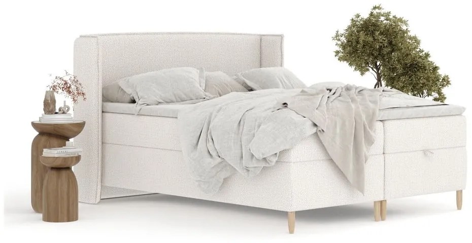 Kremowe łóżko boxspring ze schowkiem 180x200 cm Monpelli – Maison de Rêve