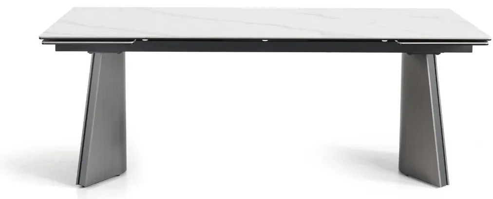 Nowoczesny stół rozkładany Nexus o wymiarach 200(280)×90 cm zachwyca eleganckim blatem z masy ceramicznej i solidną podstawą ze stali szczotkowanej. Styl, trwałość i funkcjonalność w jednym – idealny do jadalni i salonu.