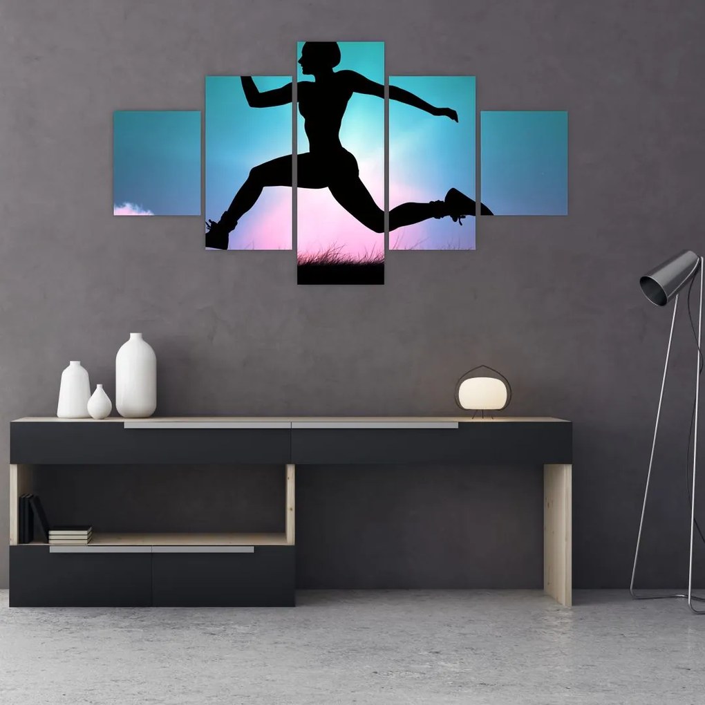 Obraz skaczącej sylwetki kobiety (125x70 cm)