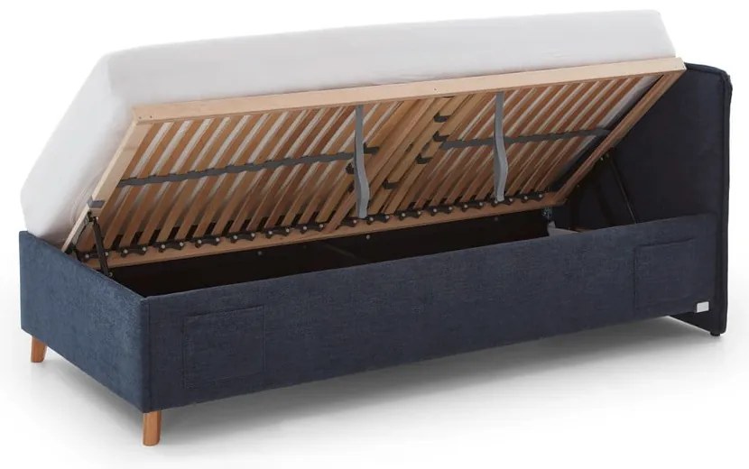 Ciemnoniebieskie tapicerowane łóżko dziecięce ze schowkiem ze stelażem 140x200 cm Fun – Meise Möbel