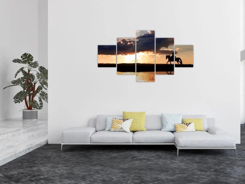 Obraz - Jeździec na koniu o zachodzie słońca (125x70 cm)