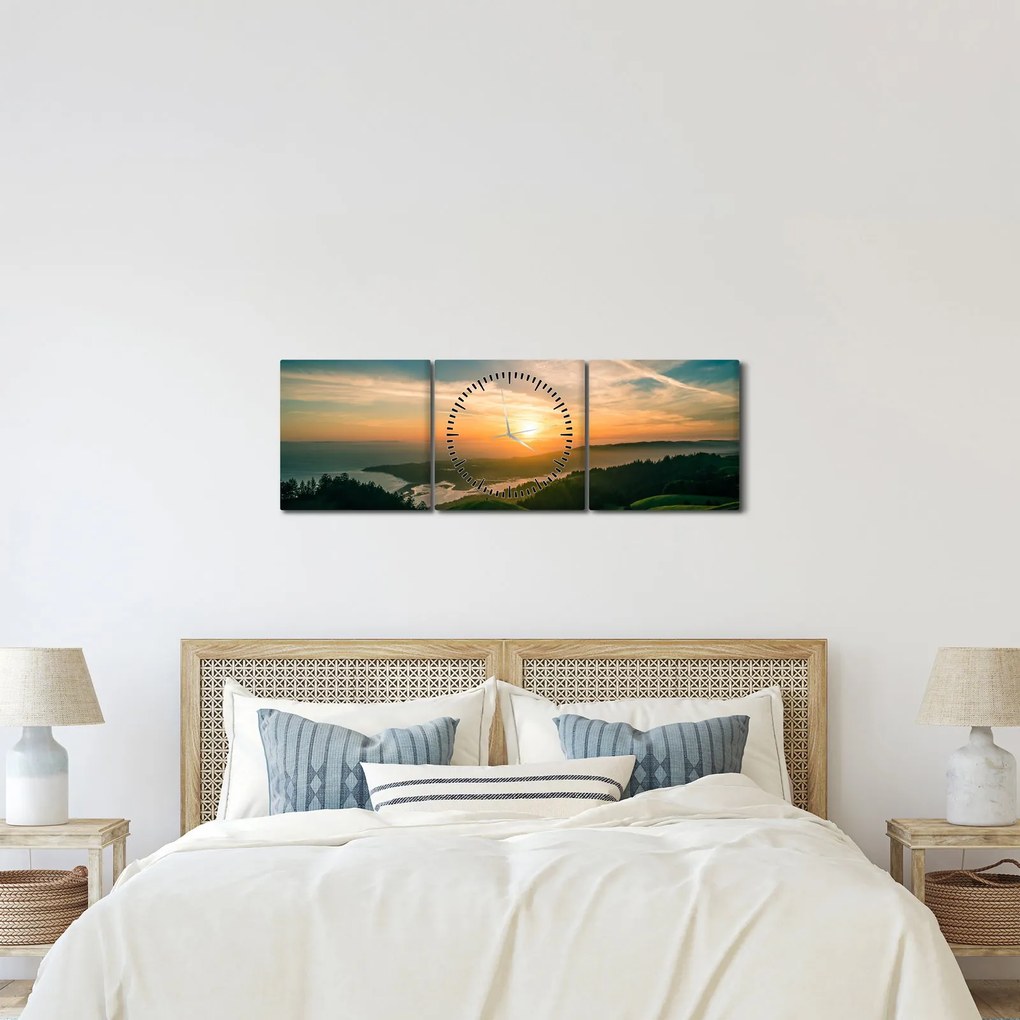 Obraz wschodu słońca nad morzem (z zegarem) (90x30 cm)