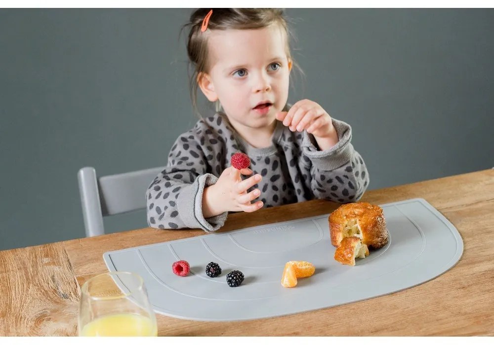 Niebieska silikonowa mata stołowa Kindsgut Rainbow, 47x26 cm