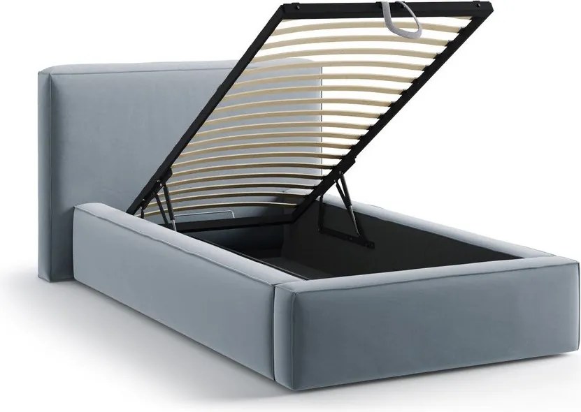 Jasnoniebieskie tapicerowane łóżko jednoosobowe ze schowkiem i stelażem 90x200 cm Jodie – Micadoni