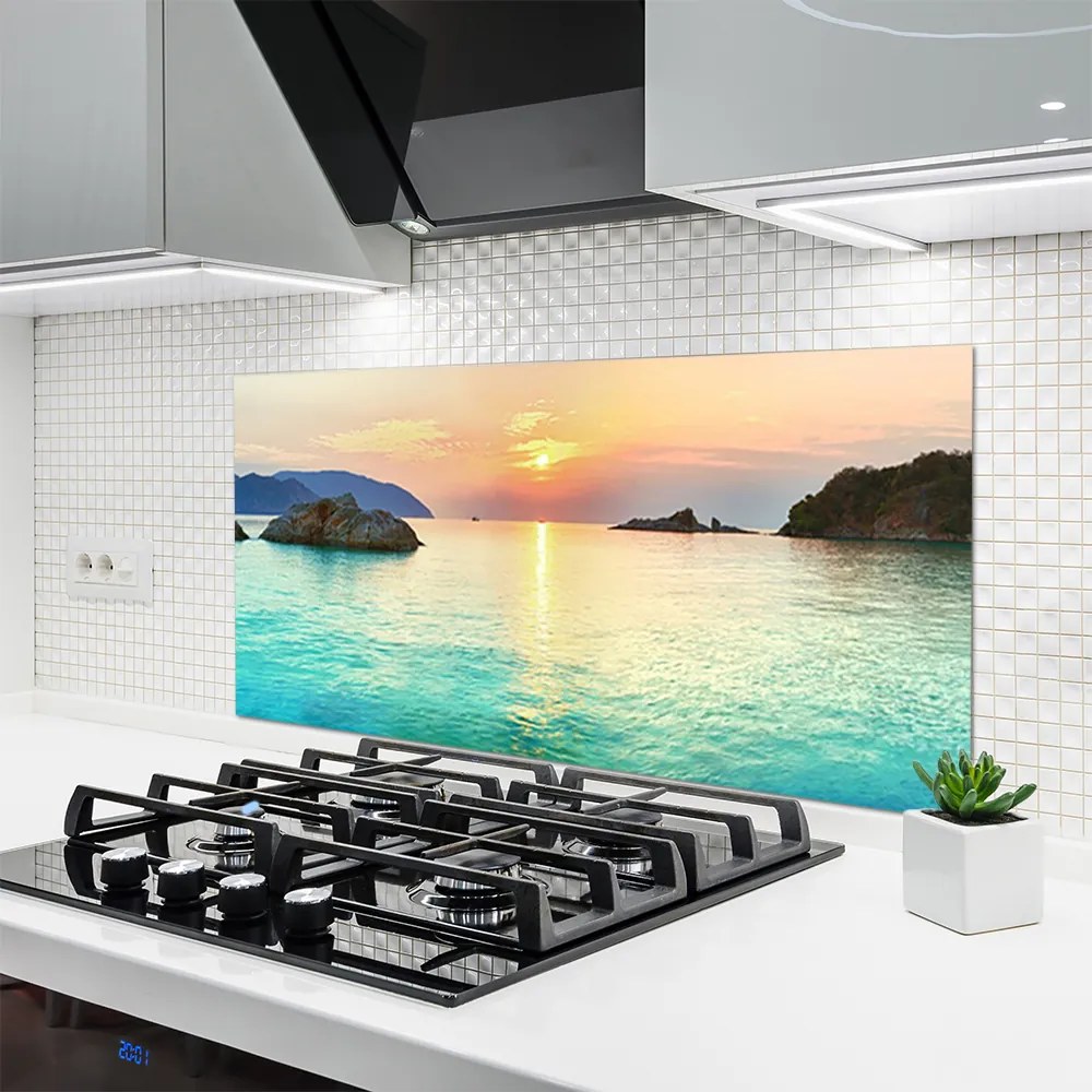 Panel Szklany Słoneczny Blask na Skalistym Brzegu