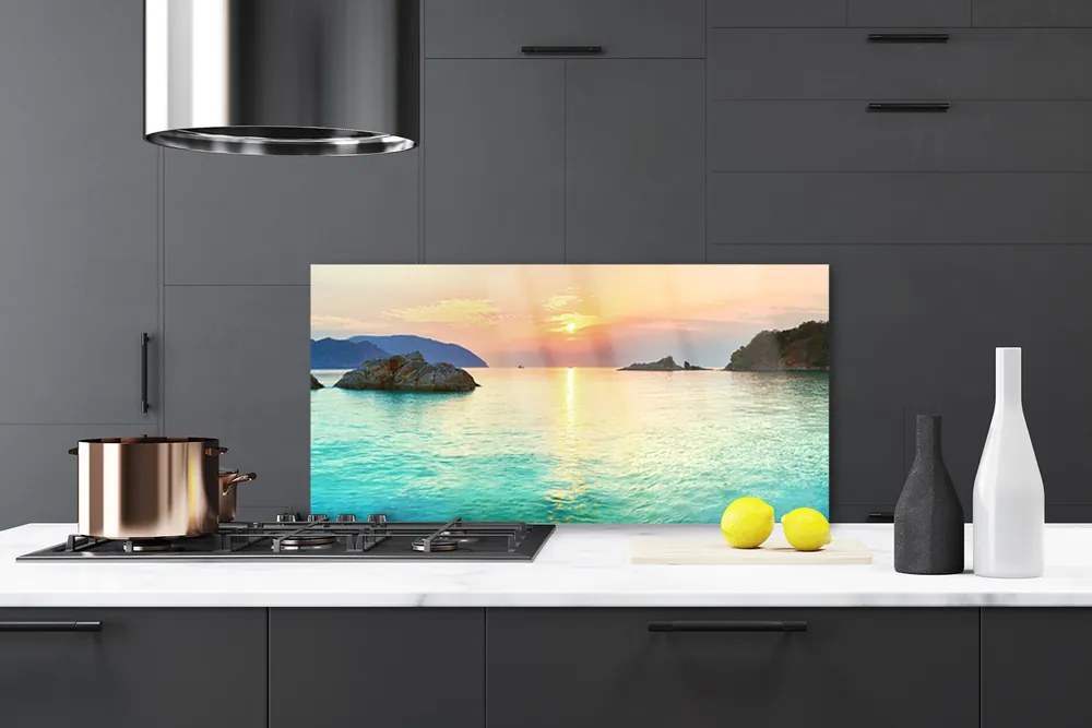 Panel Szklany Słoneczny Blask na Skalistym Brzegu