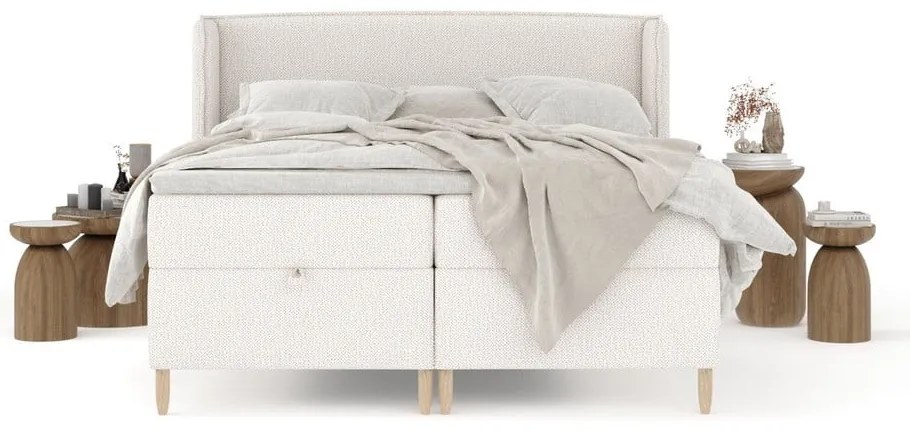 Kremowe łóżko boxspring ze schowkiem 200x200 cm Monpelli – Maison de Rêve