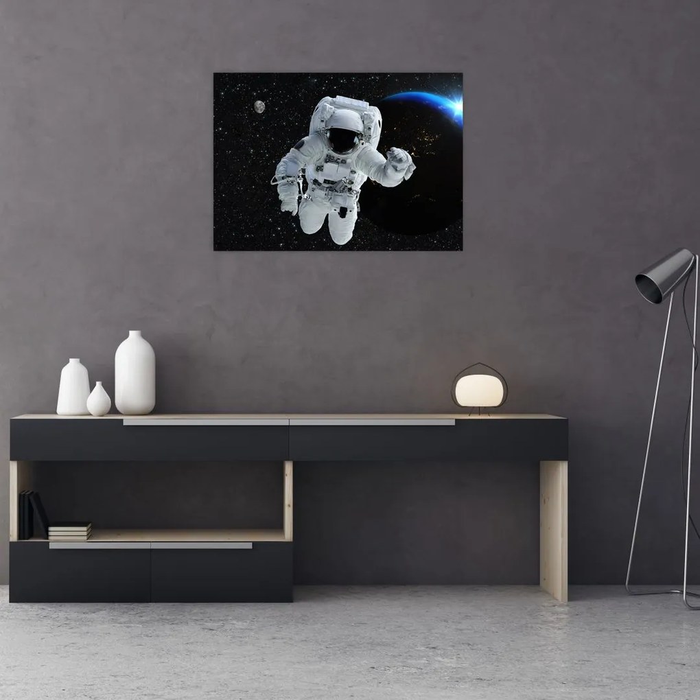 Obraz na szkle - Astronauta w kosmosie (70x50 cm)