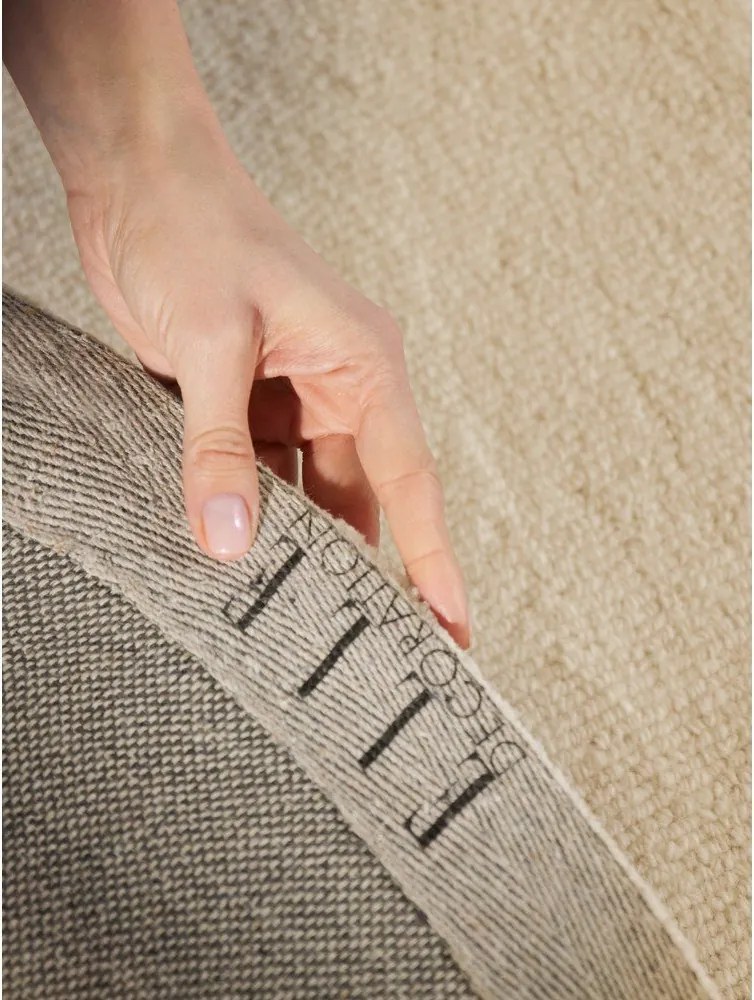 Beżowy wełniany okrągły dywan tkany ręcznie ø 160 cm Puristic Knots – Elle Decoration