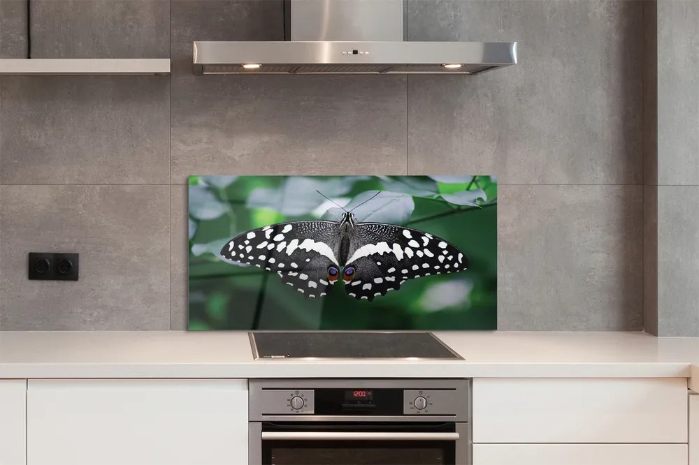 Panel Szklany Motyl na Zielonych Liściach