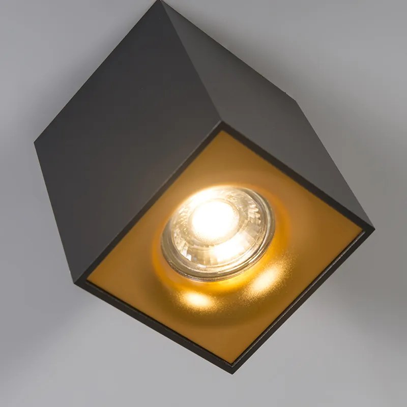 Nowoczesny reflektor czarny ze złotem - Quba Delux